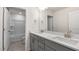 Modern bathroom with double vanity, quartz counters, gray cabinets, and tile flooring at 269 Umstead St, Sanford, NC 27330