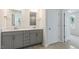 Bathroom featuring a double sink vanity with gray cabinets and hard surface countertop at 269 Umstead St, Sanford, NC 27330