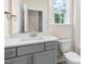 Clean bathroom featuring modern vanity, fixtures, and a toilet at 269 Umstead St, Sanford, NC 27330