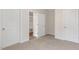 Bedroom features neutral carpet and walk-in closet at 269 Umstead St, Sanford, NC 27330