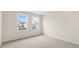 Bright bedroom featuring neutral carpet, white walls, and double windows offering natural light at 269 Umstead St, Sanford, NC 27330
