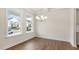 Light-filled dining room features hardwood floors and views of the neighborhood through large windows at 269 Umstead St, Sanford, NC 27330