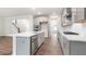 Gourmet kitchen featuring quartz countertops, stainless steel appliances, and gray cabinetry at 269 Umstead St, Sanford, NC 27330
