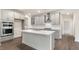 Stylish kitchen with quartz countertops, stainless steel appliances, and gray cabinetry at 269 Umstead St, Sanford, NC 27330