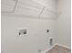 Bare laundry room featuring washer and dryer hookups and shelving at 269 Umstead St, Sanford, NC 27330