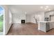 Open-concept living area features modern finishes, fireplace, and seamless flow to the kitchen at 269 Umstead St, Sanford, NC 27330