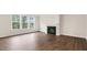 Cozy living room with large windows and fireplace at 269 Umstead St, Sanford, NC 27330