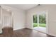 Bright living room featuring hardwood floors and sliding glass doors to the backyard at 269 Umstead St, Sanford, NC 27330