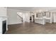 Spacious living area flowing into a modern kitchen with an island and a fireplace at 269 Umstead St, Sanford, NC 27330
