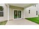 A covered patio featuring a sliding glass door that overlooks the lawn and landscaping at 269 Umstead St, Sanford, NC 27330