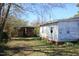 View of the backyard and the red outbuilding at 2984 Ashe Ave, Dunn, NC 28334