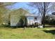 Exterior view of the side and back of a house with damaged siding at 2984 Ashe Ave, Dunn, NC 28334