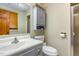 Bathroom featuring vanity with storage, a toilet, and a glass enclosed shower at 3101 Rutledge Ct, Raleigh, NC 27613