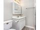 Cozy bathroom features a vanity with storage, a mirrored cabinet, and modern fixtures at 3101 Rutledge Ct, Raleigh, NC 27613