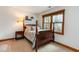 Cozy bedroom featuring a four-poster bed, natural light from the window and tasteful decor at 3101 Rutledge Ct, Raleigh, NC 27613