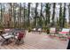 Outdoor deck area surrounded by lush greenery and with outdoor seating at 3101 Rutledge Ct, Raleigh, NC 27613