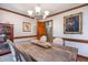 Formal dining room with rustic wood table and decorative wall art at 3101 Rutledge Ct, Raleigh, NC 27613