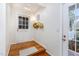 Bright foyer featuring hardwood floors, front door with transoms and coat rack at 3101 Rutledge Ct, Raleigh, NC 27613