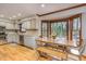 Inviting kitchen featuring stainless appliances, granite counters and view of trees at 3101 Rutledge Ct, Raleigh, NC 27613