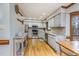 Bright kitchen with stainless steel appliances, granite countertops, and hardwood floors at 3101 Rutledge Ct, Raleigh, NC 27613