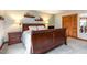 Main bedroom with wood furniture, closet, neutral color scheme, and carpet at 3101 Rutledge Ct, Raleigh, NC 27613