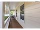 Relaxing front porch with wooden floors and white railings offering outdoor living space at 3101 Rutledge Ct, Raleigh, NC 27613