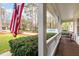 Inviting front porch with white railing and rocking chair, perfect for enjoying the outdoors at 3101 Rutledge Ct, Raleigh, NC 27613