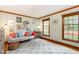 Bright sitting room with couch, area rug, decorative pillows, and natural light at 3101 Rutledge Ct, Raleigh, NC 27613