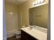 Bathroom showcasing a white shower-tub combo, toilet, and vanity with a white sink at 316 Arbor Greene Dr, Garner, NC 27529