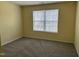 Bedroom features neutral carpet, light-colored walls, and a window with blinds at 316 Arbor Greene Dr, Garner, NC 27529