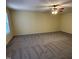 Spacious bedroom with carpet, ceiling fan with lights, and natural light at 316 Arbor Greene Dr, Garner, NC 27529