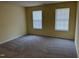 Bedroom with neutral carpet, light-colored walls, and two windows with blinds at 316 Arbor Greene Dr, Garner, NC 27529