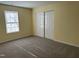 Bedroom featuring a window letting in natural light and a closet with sliding doors at 316 Arbor Greene Dr, Garner, NC 27529