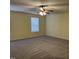 Spacious bedroom with carpet, ceiling fan with lights, and natural light at 316 Arbor Greene Dr, Garner, NC 27529
