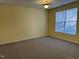 Bright bedroom with soft carpet, a large window, and neutral wall color, offering a cozy atmosphere at 316 Arbor Greene Dr, Garner, NC 27529