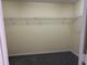 Walk in closet has wire shelving and neutral carpet at 316 Arbor Greene Dr, Garner, NC 27529