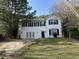 Charming two-story home with a well-manicured lawn and a classic black door at 316 Arbor Greene Dr, Garner, NC 27529