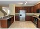 Spacious kitchen with stainless steel appliances and wooden cabinets at 316 Arbor Greene Dr, Garner, NC 27529