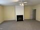 Spacious living room with fireplace and neutral carpet at 316 Arbor Greene Dr, Garner, NC 27529