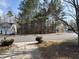 Neighborhood street view showing a house, trees, and a well-maintained road at 316 Arbor Greene Dr, Garner, NC 27529