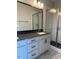 Modern bathroom with double sinks, a large mirror, and a glass-enclosed shower at 321 Kavanaugh Rd, Wake Forest, NC 27587