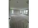 Large, carpeted bedroom with multiple windows providing natural light at 321 Kavanaugh Rd, Wake Forest, NC 27587