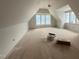 Attic space with natural light, ceiling fan, and bonus nook at 3405 Makers Circle, Raleigh, NC 27612