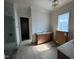 Bathroom with a new vanity, framed mirror, tiled shower, and light fixture at 3405 Makers Circle, Raleigh, NC 27612