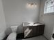 Bathroom features dark wood vanity with a marble countertop and elegant light fixture at 3405 Makers Circle, Raleigh, NC 27612