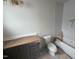 Bathroom featuring a stylish vanity, toilet, and a tub with tiled walls at 3405 Makers Circle, Raleigh, NC 27612