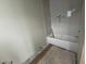 Modern bathroom featuring a new bathtub and contemporary herringbone tile at 3405 Makers Circle, Raleigh, NC 27612