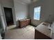 Bathroom featuring dual vanities with granite countertops, providing ample space and convenience at 3405 Makers Circle, Raleigh, NC 27612