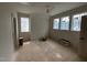Bedroom with three windows and a ceiling fan, still under construction at 3405 Makers Circle, Raleigh, NC 27612