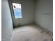 Unfinished bedroom featuring a bright window, awaiting personalization and finishing touches at 3405 Makers Circle, Raleigh, NC 27612